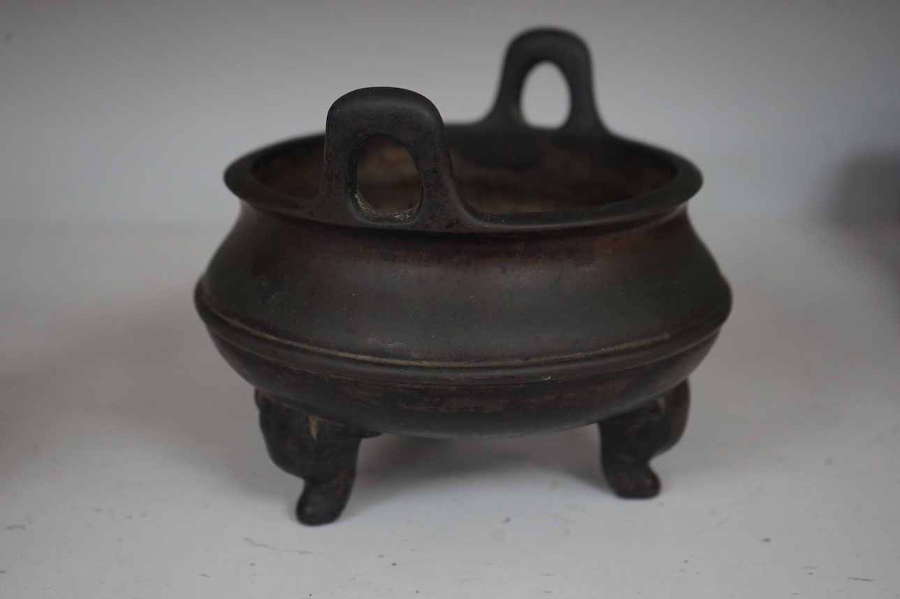 A Chinese bronze censer, character mark to base, 14cm. Condition - fair to good